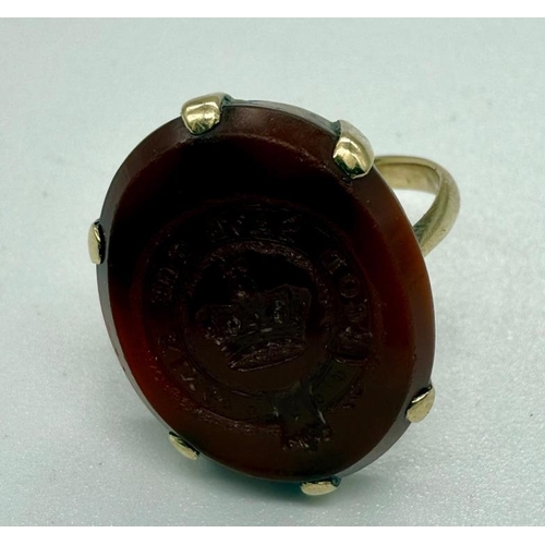 528 - An English 18th century gold and ruby morning ring and a 19th century gold and carnelian ring