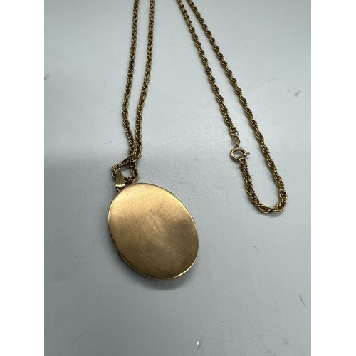 531 - A 9ct gold locket, with floral design and necklace, 37cm drop