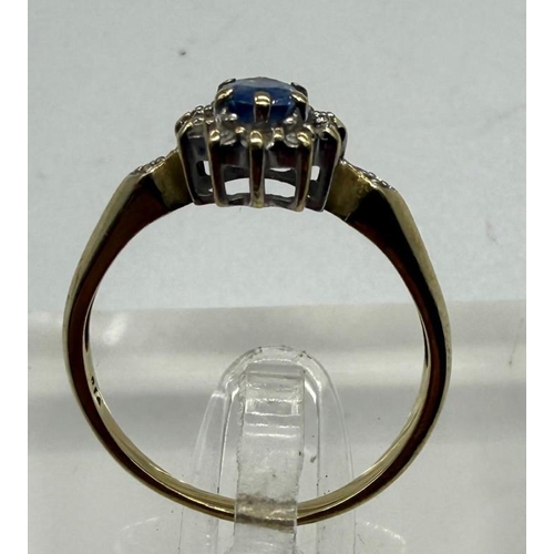 539 - A 9ct gold ring with diamond shoulder, approximate weight 1.9g and size N.5