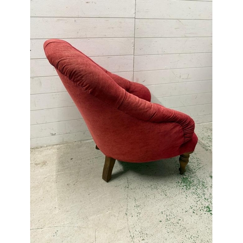 57 - A red upholstered button back bedroom chair on turned legs