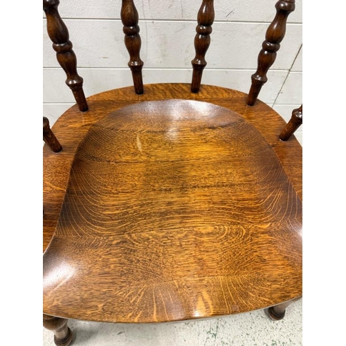 59 - An oak Captain chair