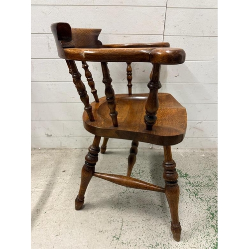 59 - An oak Captain chair