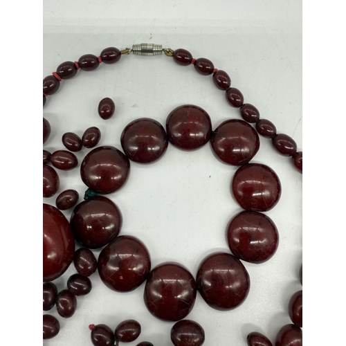 618 - A selection of cherry amber jewellery to include a graduated necklace, bracelet and a election of lo... 