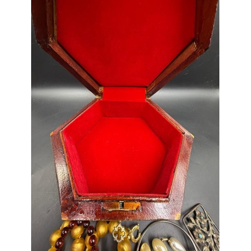 630 - A selection of quality costume jewellery in an inlaid jewellery box with key.