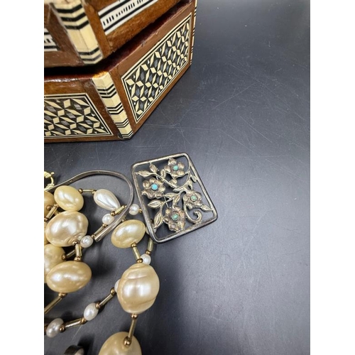 630 - A selection of quality costume jewellery in an inlaid jewellery box with key.