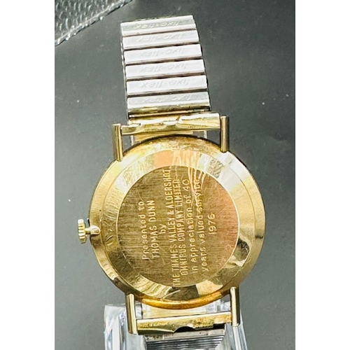 647 - A gold Omega wristwatch, engraved to back