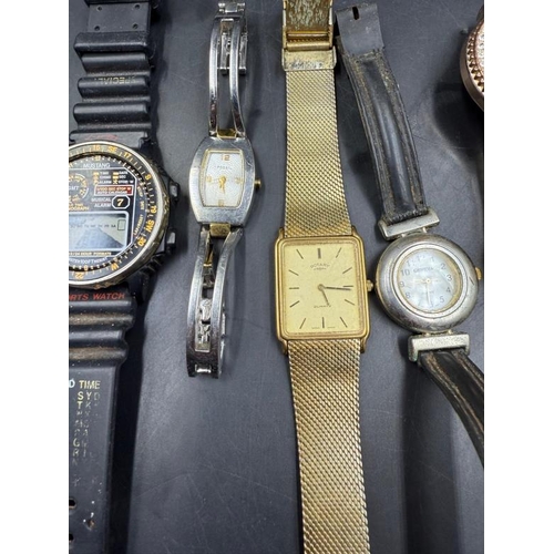 653 - A selection of ladies and gentleman's wristwatches to include Rotary, Fossil and Timex