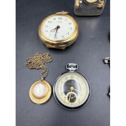 656 - A selection of time pieces to include nurses fob watches, pocket watches and a desk clock