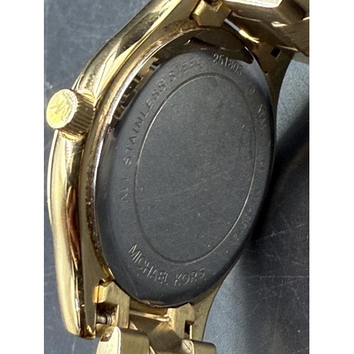 664 - A Michael Kors slim runway 42mm three hand movement ladies wristwatch in stainless steel gold, boxed