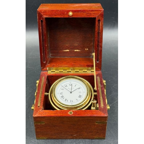 668 - A Jean Roulet LeLocle mahogany cased deck watch in a three tier brass gimbal