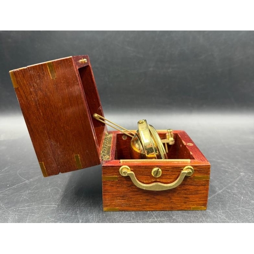 668 - A Jean Roulet LeLocle mahogany cased deck watch in a three tier brass gimbal