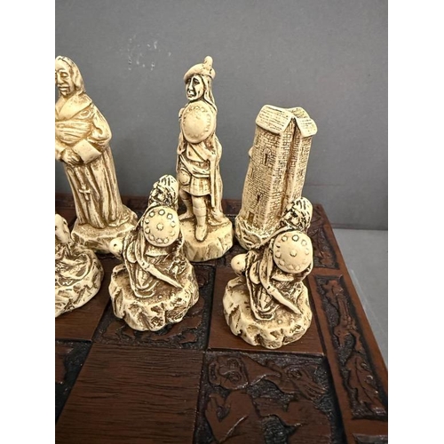 826 - A battle of Culloden themed resin chess set on a hard wood board