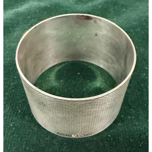 500A - A hallmarked silver napkin ring along with a Krupp Bergdorf 'Hotel Rosat' napkin ring