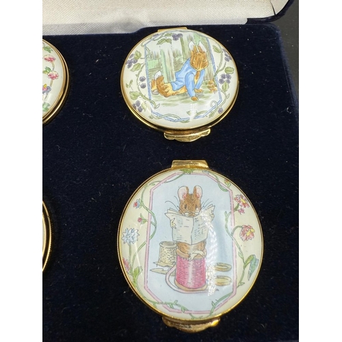 303 - A boxed set of six Royal Doulton enamel pill pots