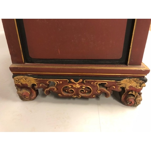 42 - Chinese wedding cabinet of red and gold lacquer, the front panels and doors profusely carved in pier... 