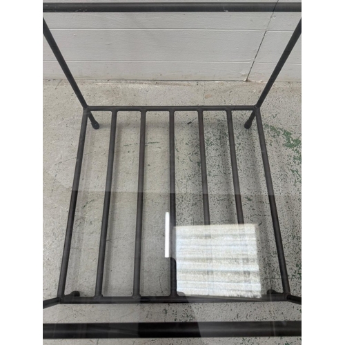 54 - A wrought iron glass topped side table with shelf under (H51cm W60cm D60cm)