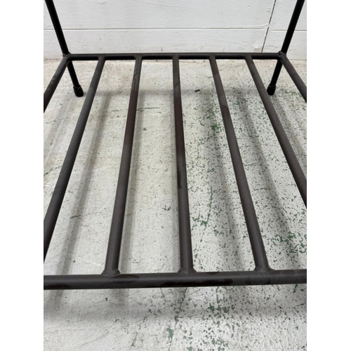 54 - A wrought iron glass topped side table with shelf under (H51cm W60cm D60cm)