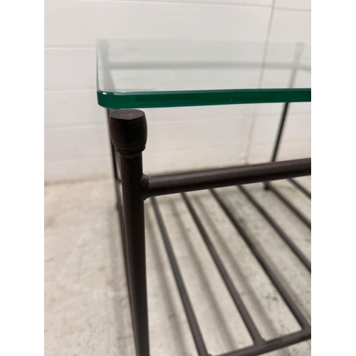 54 - A wrought iron glass topped side table with shelf under (H51cm W60cm D60cm)