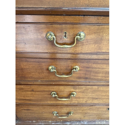 25 - A mahogany bureau comprising of two short drawers over three graduated long, the fall opening to pig... 