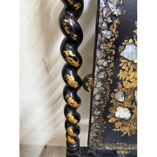 27 - A black lacquer hall chair with mother of pearl inlay, barley twist supports and wicker seat