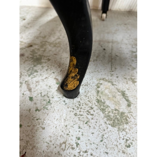 28 - A Mid 19th Century black lacquer open arm chair with mother-of-pearl inlay, gilt foliate decoration ... 