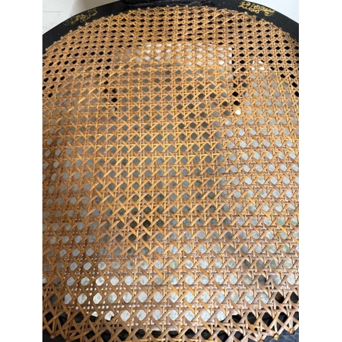 28 - A Mid 19th Century black lacquer open arm chair with mother-of-pearl inlay, gilt foliate decoration ... 