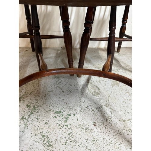 29 - A Windsor open arm chair and two spindle back dining chairs