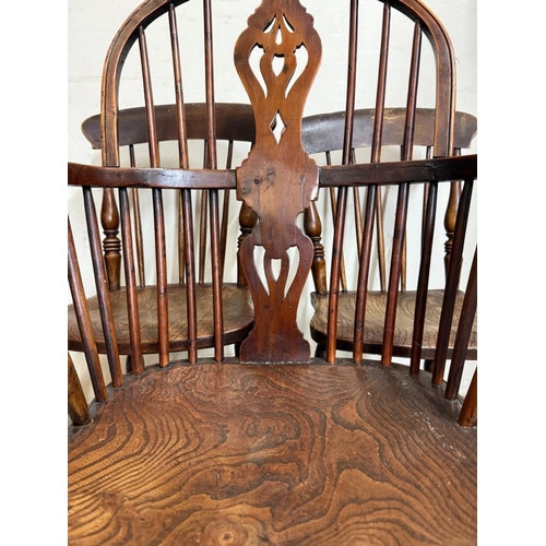 29 - A Windsor open arm chair and two spindle back dining chairs