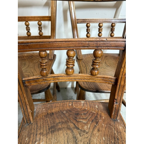 30 - Three oak bar back kitchen chairs on turned legs and with turned spindles