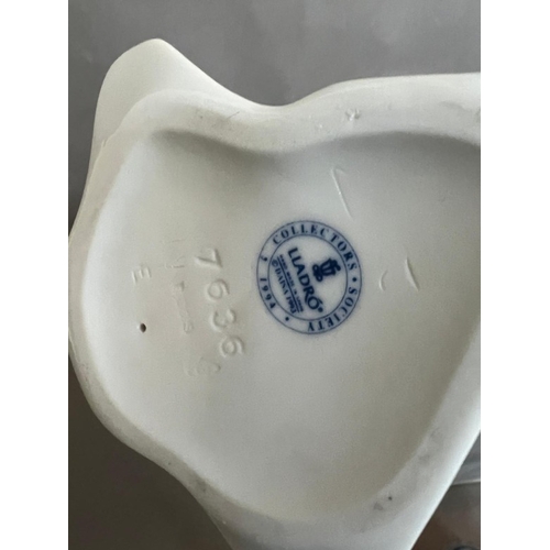 55 - Two Lladro figures: A pipe on a stand and a lady with a parasol