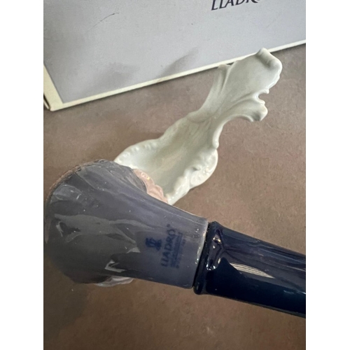 55 - Two Lladro figures: A pipe on a stand and a lady with a parasol