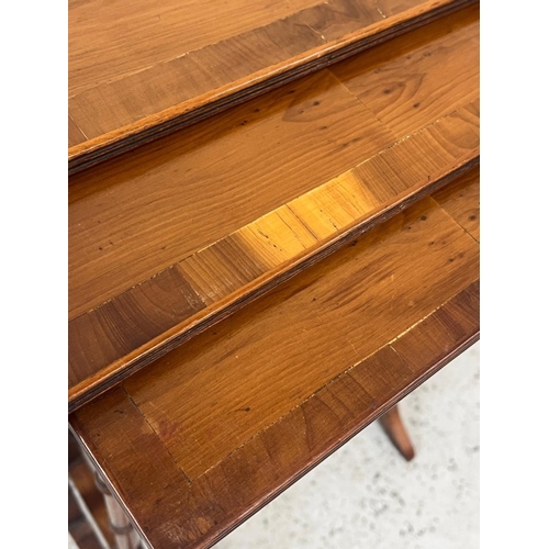 11 - A nest of three tables on turned legs (H57cm x 34cm x 50cm)