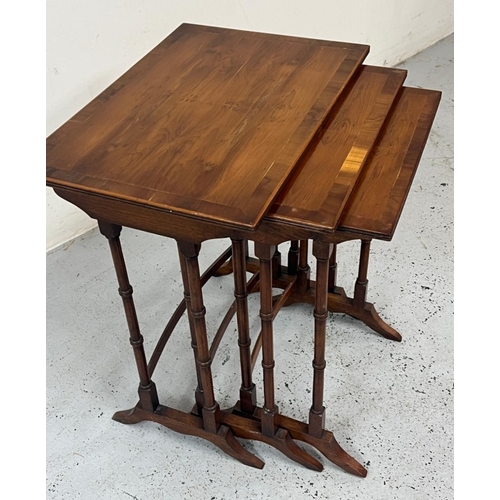 11 - A nest of three tables on turned legs (H57cm x 34cm x 50cm)