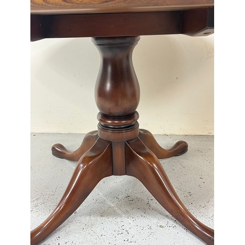 10 - A Stewart Linford oval dining table on a pedestal base H72cm W153cm D104cm