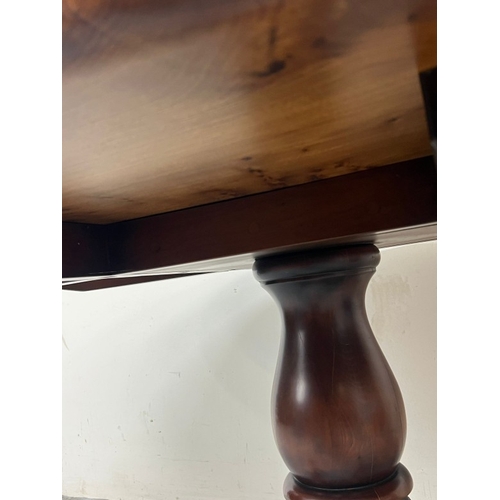 10 - A Stewart Linford oval dining table on a pedestal base H72cm W153cm D104cm