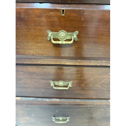 121 - A mahogany linen press comprising of a two over two chest witha two door cupboard over H197cm W122cm... 