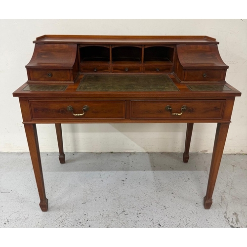 122 - An Edwardian style mahogany writing table with tooled green leather writing surface H98cm W106cm D54... 