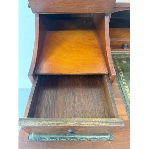 122 - An Edwardian style mahogany writing table with tooled green leather writing surface H98cm W106cm D54... 