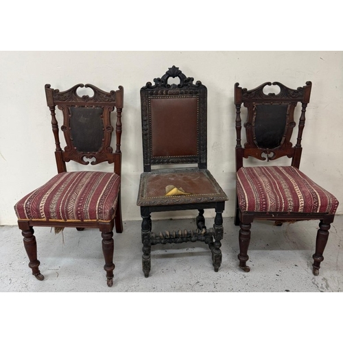 129 - A harlequin set of three carved hall chairs