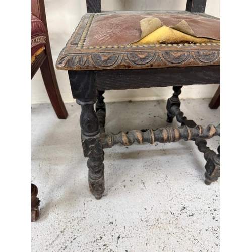 129 - A harlequin set of three carved hall chairs