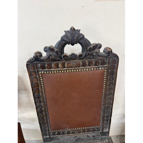 129 - A harlequin set of three carved hall chairs