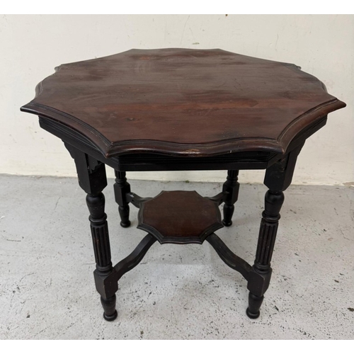 130 - A mahogany octagonal occasional table on fluted legs with a shelf under H68cm W80cm D80cm