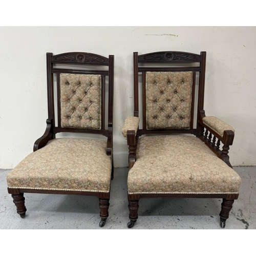 131 - A pair of mahogany-framed his and her fireside chairs in a floral damask fabric