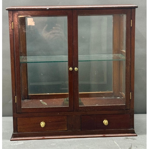133 - A mahogany-glazed table top display cabinet with two drawers under