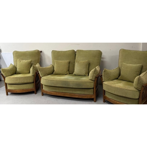 137 - An Ercol three-piece suite upholstered in green