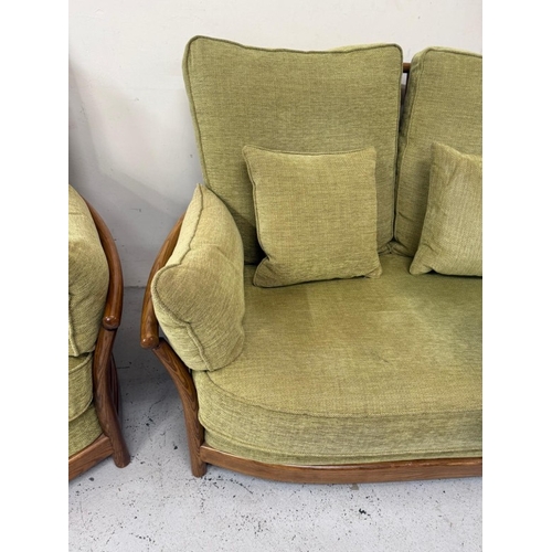 137 - An Ercol three-piece suite upholstered in green