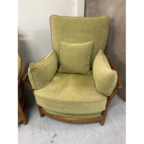 137 - An Ercol three-piece suite upholstered in green