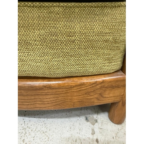 137 - An Ercol three-piece suite upholstered in green
