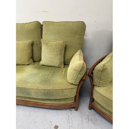 137 - An Ercol three-piece suite upholstered in green