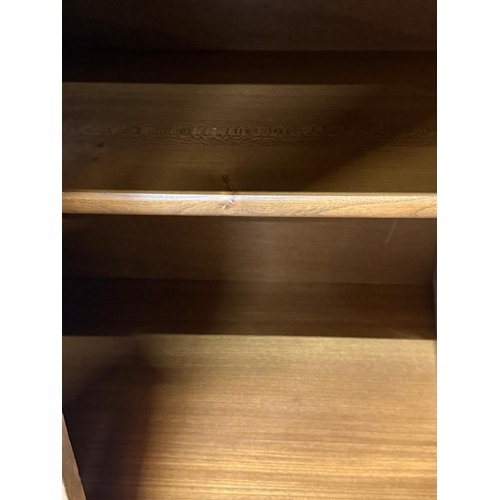 138 - An Ercol mural two-door display cabinet over a two-door cupboard H197cm W98cm D49